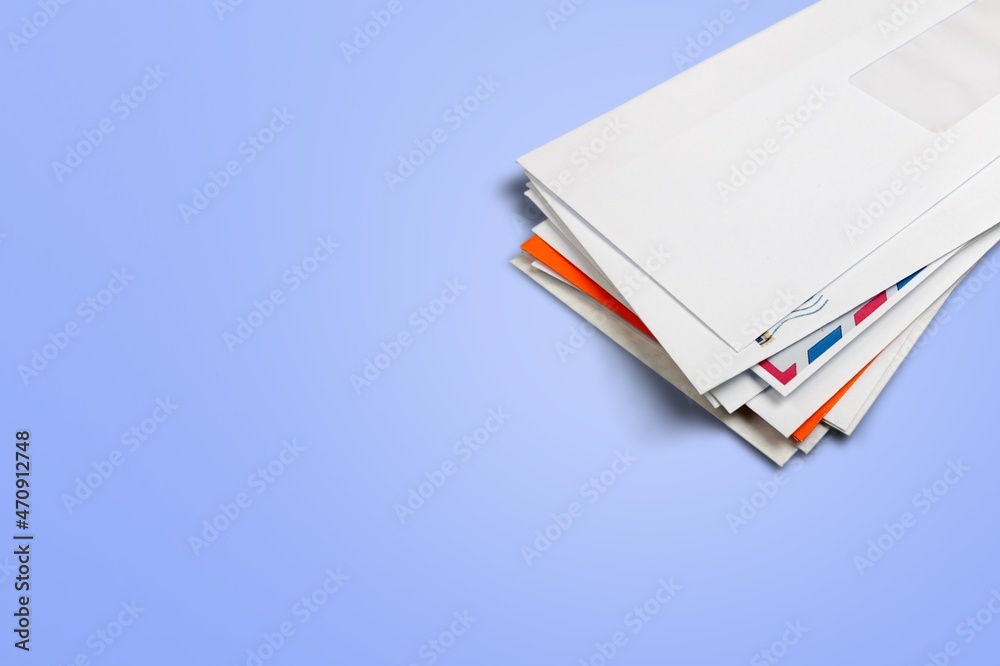 White envelopes on the background, made of paper, used to enclose letters or document. White envelopes on the background, made of paper, used to enclose letters or document.