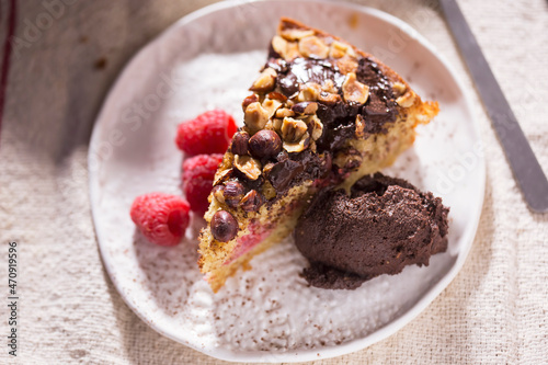Hazelnut chocolate cake with raspberries and chocolate mousse 
