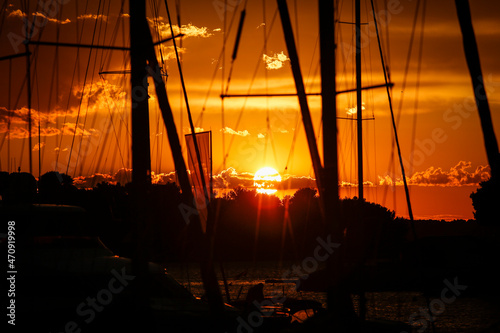 Beautiful sunset under the silhouettes of masts in Croatia