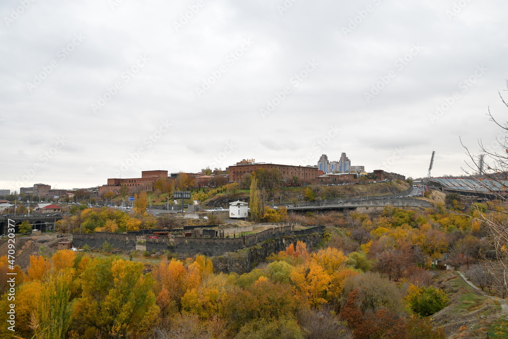 Panoramic view of the city and the Ararat brandy factory in Yerevan. On the roof of the building there is an inscription in Armenian and Russian. YEREVAN BRANDY FACTORY. November 11, 2021, Yerevan, Ar