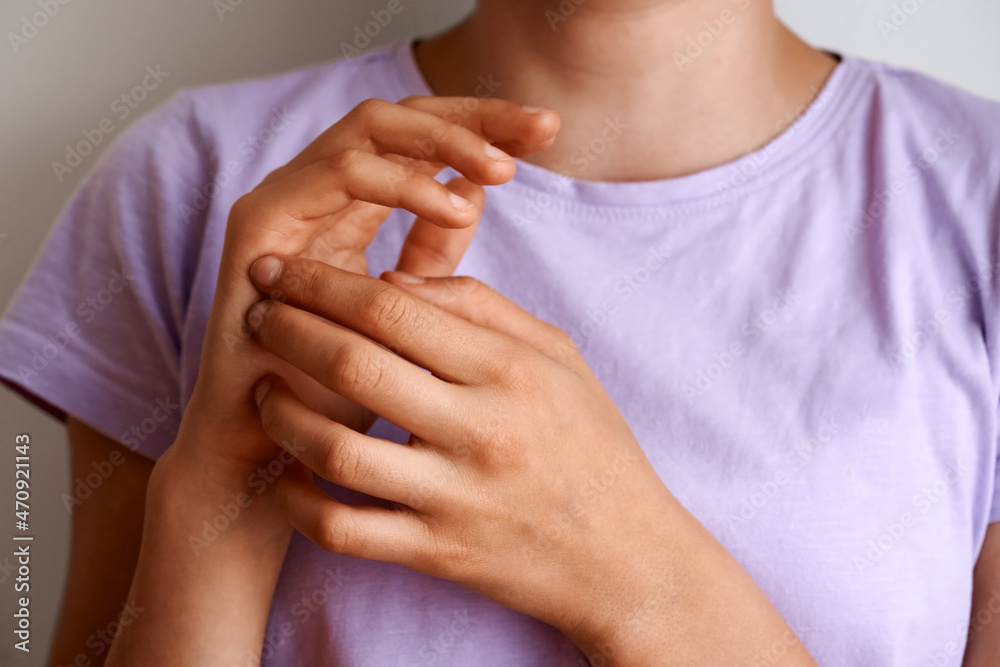 Teenage girl practicing EFT tapping or emotional freedom technique Teenage girl practicing EFT tapping or emotional freedom technique