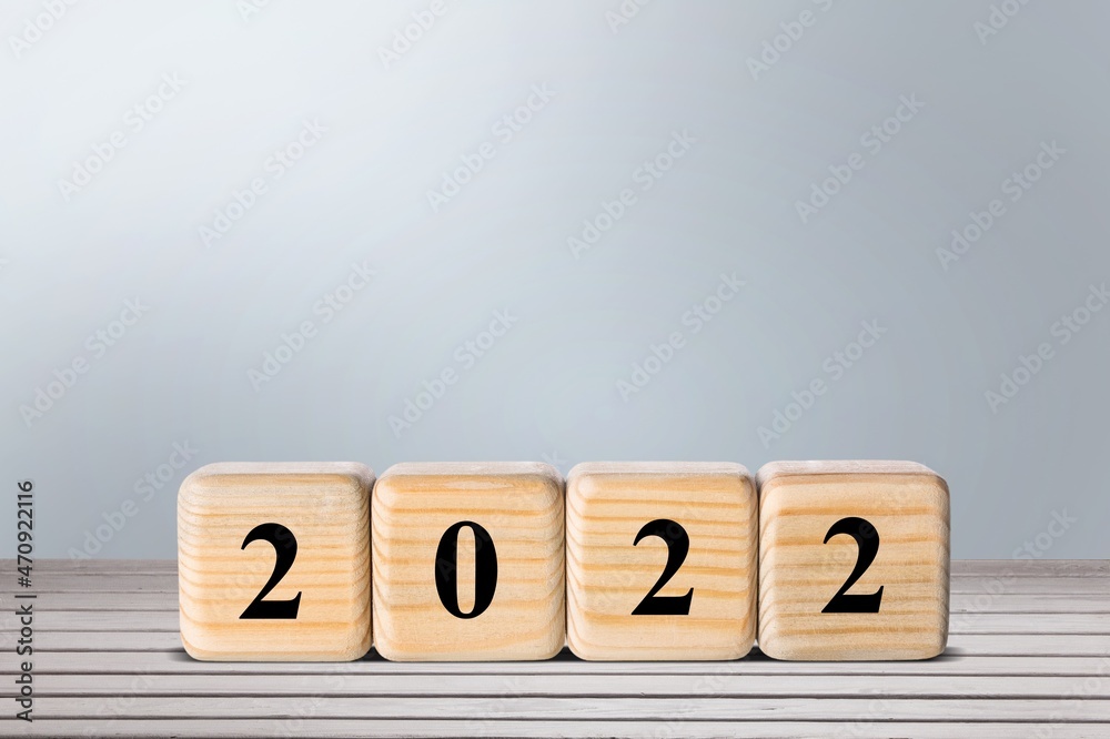 woodblocks cubes with a number 2021 change to 2022 . new year 2021- 2022 concept. woodblocks cubes with a number 2021 change to 2022 . new year 2021- 2022 concept.