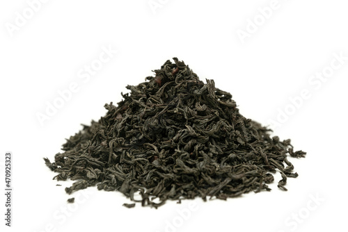 Heap of dried black tea on a white background