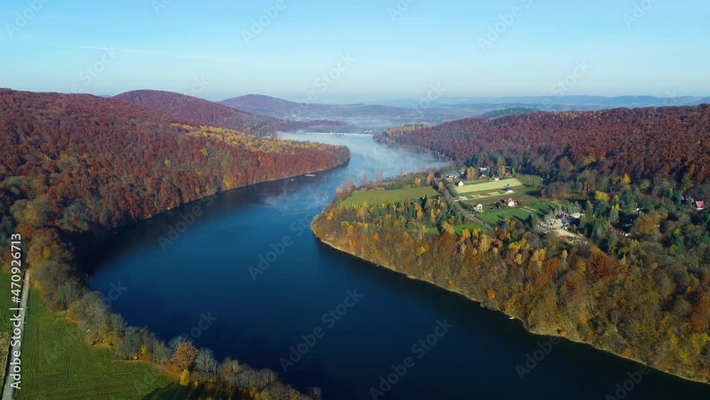Aerial view of river with morning fog, flowing among the mountains. Aerial view of beautiful colorful fall landscape. Autumn in mountains, epic aerial vista. Aerial view of river with morning fog, flowing among the mountains. Aerial view of beautiful colorful fall landscape. Autumn in mountains, epic aerial vista.