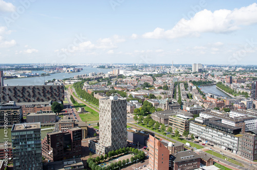 Aerial view of the Rotterdam skyline with in the background a lot of industry in the Netherlands