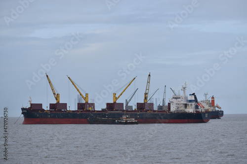 India 18 november 2021 .Loading goods on cargo ship with crane