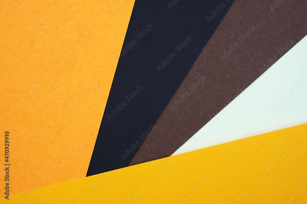 Abstract background from sheets of orange, and brown paper. Abstract paper colorful background, creative design. background with geometric shapes, diagonal lines. Thick paper of different colors top