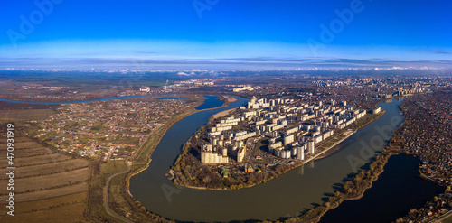 aerial panorama of the Yubileiny microdistrict on the western outskirts of the city of Krasnodar (South of Russia) at the bend of the Kuban River on a sunny autumn day
