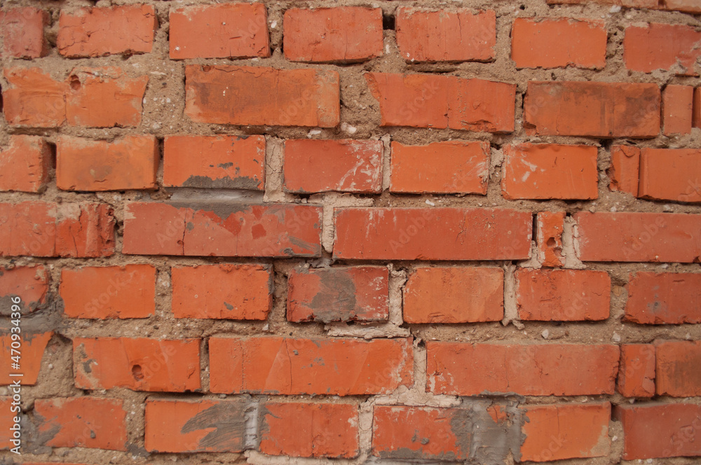 Obraz premium a wall of old red brick with a solid background
