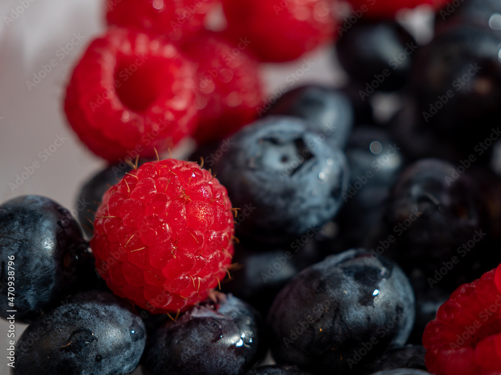 Fresh mixed berries as a background. Blueberries and raspberries. Fresh mixed berries as a background. Blueberries and raspberries.