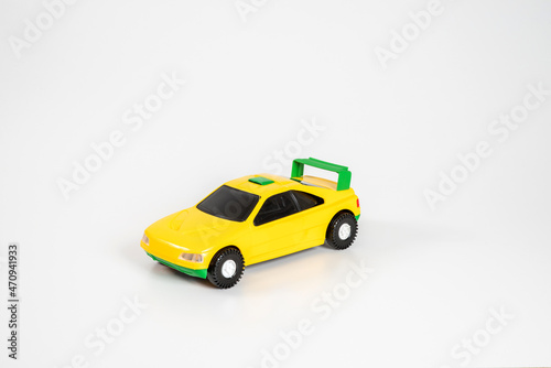 Fototapeta Naklejka Na Ścianę i Meble -  Toy plastic car isolated on white background.