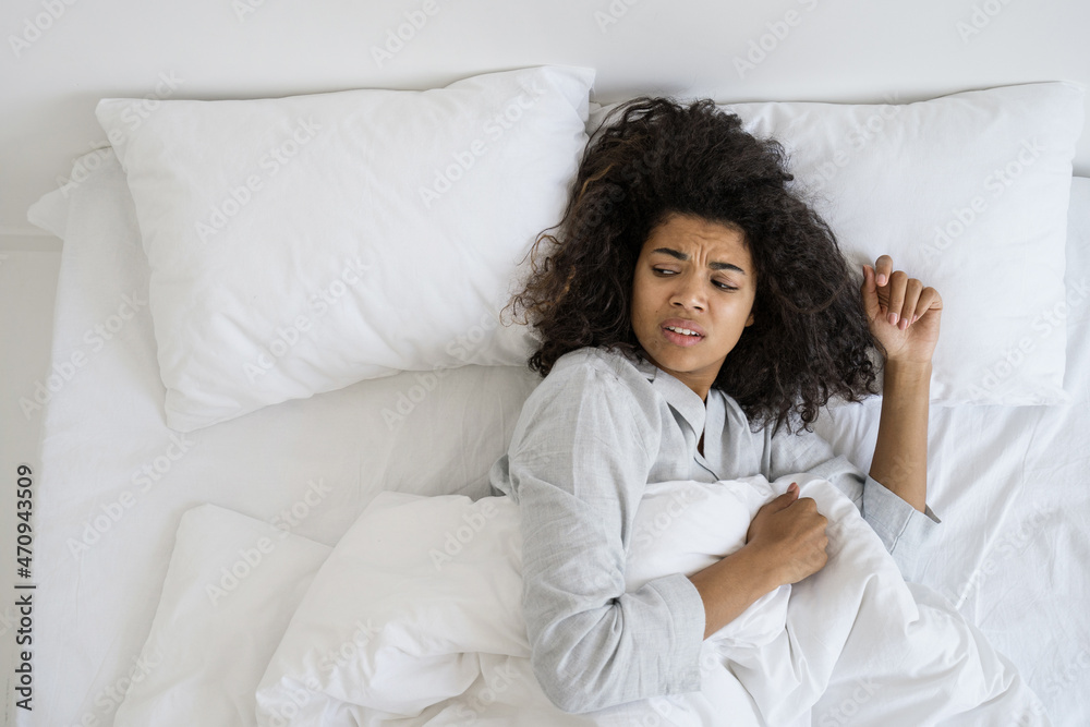 Tired african american woman waking up at morning Tired african american woman waking up at morning