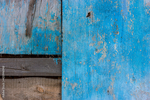 Background from old wooden boards. Wooden shield. The boards are blue.
