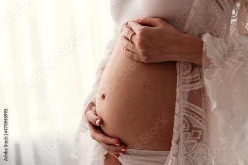 woman holding belly
