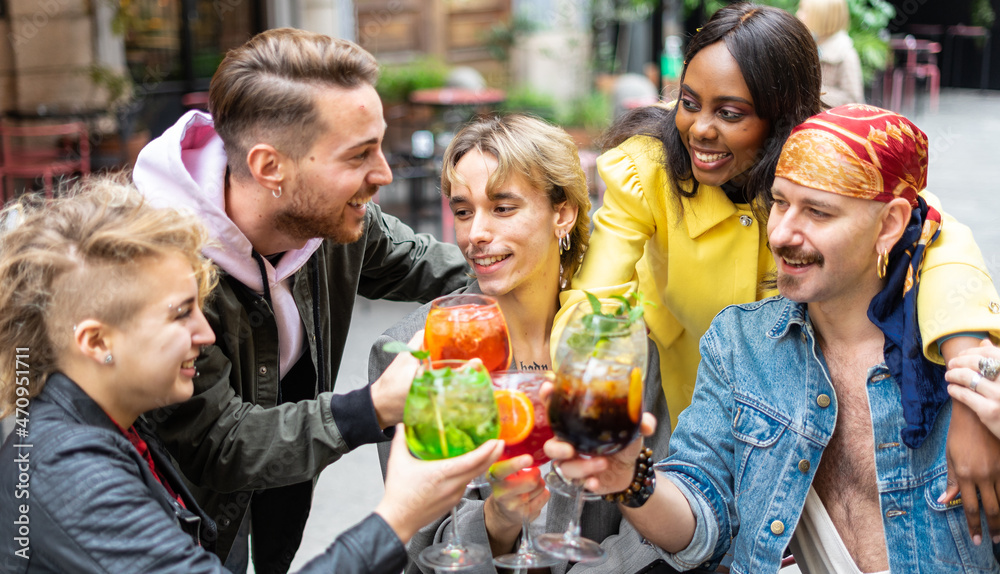 Friends toasting at city centre with multicolored cocktails - concept of aggregation, diversity and inclusion Friends toasting at city centre with multicolored cocktails - concept of aggregation, diversity and inclusion
