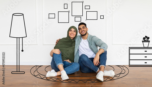фотографія Cheerful muslim couple planning and imagining new house interior