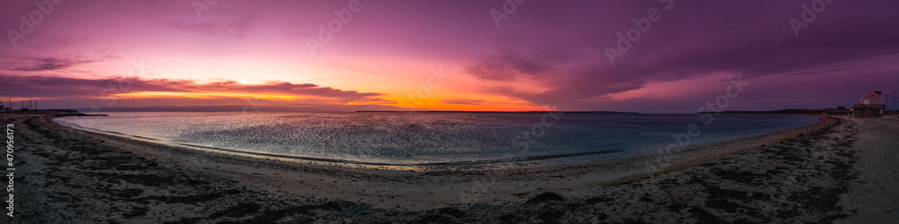 Panoramic sunrise seascape and dramatic cloudscape over Martha's Vineyard and the Atlantic Ocean. Panoramic sunrise seascape and dramatic cloudscape over Martha's Vineyard and the Atlantic Ocean.