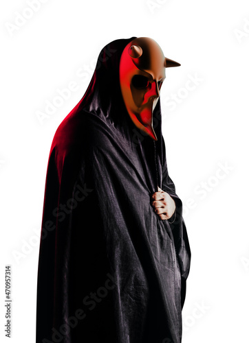 Isolated scary horror occult sectarian priest in black hood and metal mask on white background. photo