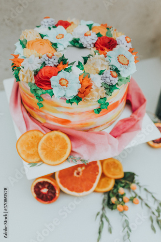 Orange citrus elopement wedding cake display  photo