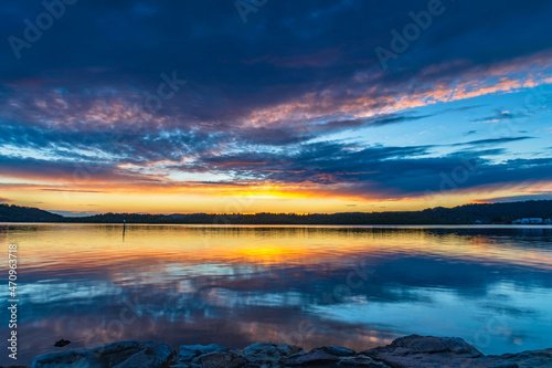 Sunrise waterscape over the bay with cloud cover