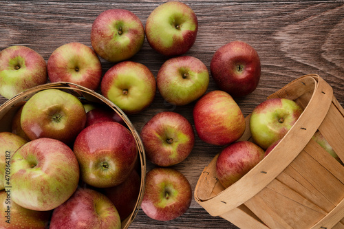 Freshly picked Macoun Apples in baskets on a wooden counter photo