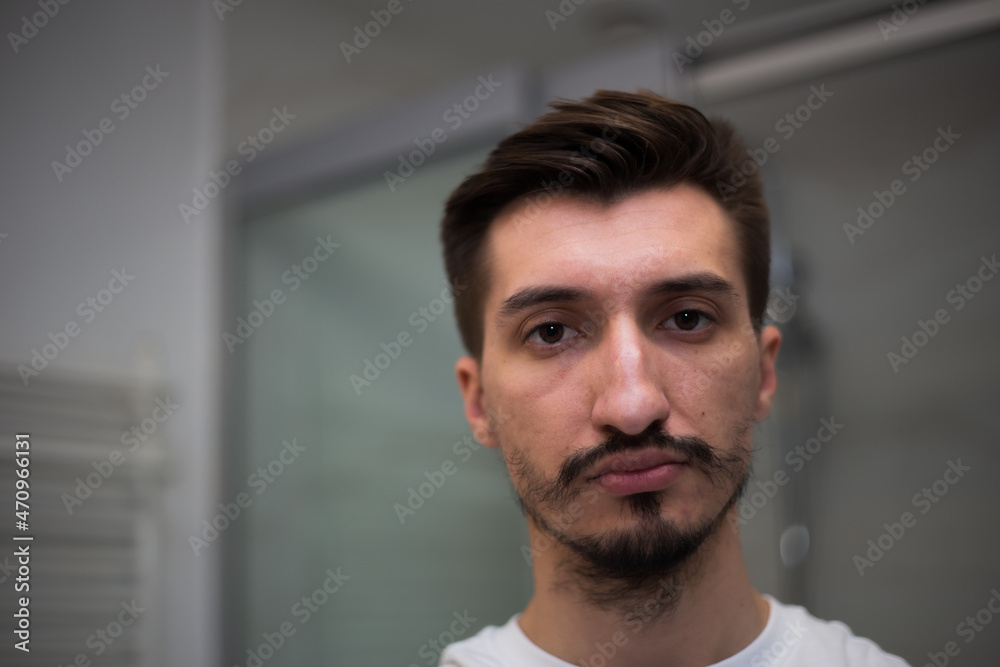 Portrait of a man with a bad heterogeneous beard Portrait of a man with a bad heterogeneous beard