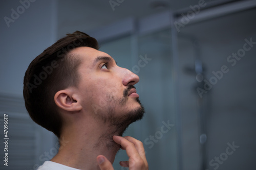 Fototapeta Naklejka Na Ścianę i Meble -  Portrait of a man with a bad heterogeneous beard