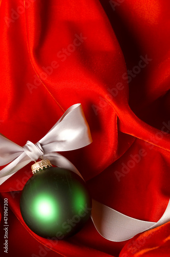 Green Ornament on Red Velvet Vertical