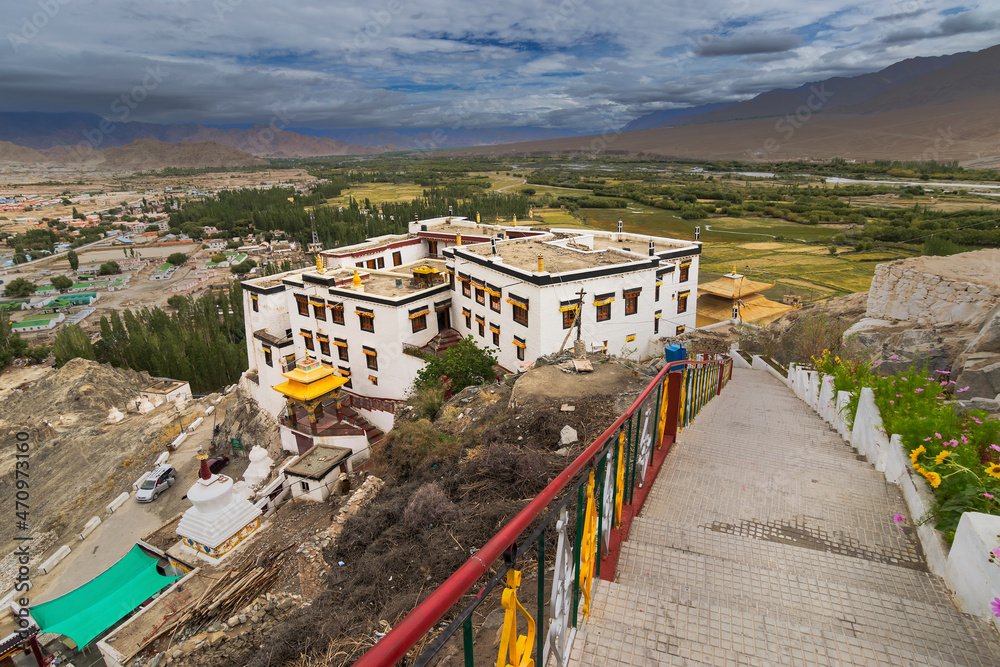 Ancient spitok monastery - stairs going down with view of Himalayan mountians outside - it is a famous Buddhist temple in Leh, Ladakh, Jammu and Kashmir, India.