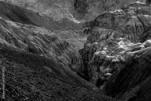 Yellow colourful rocks and stones - formation like moon surface on earth , place called moonland, mountains , ladakh landscape Leh, Jammu and Kashmir, India. Black and white image.