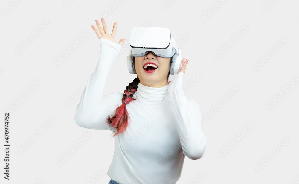 Pretty woman in white shirt wearing VR glasses connecting to virtual reality furture lifestyle on the white background. Pretty woman in white shirt wearing VR glasses connecting to virtual reality furture lifestyle on the white background.