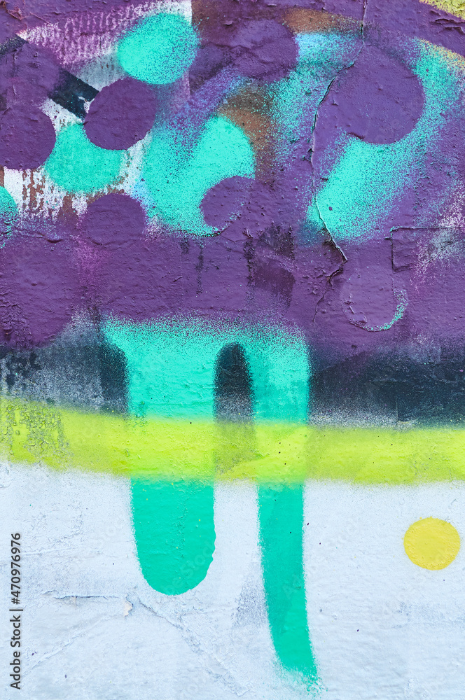 Vertical shot of color graffiti on wall