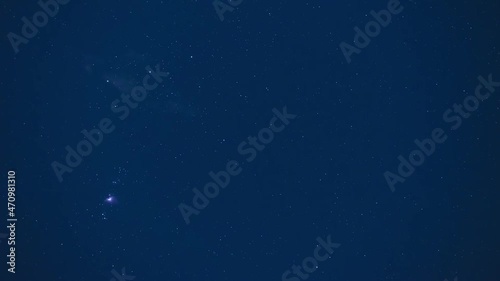 Astro timelapse of the Orion constellation with the Orion Nebula and the stars of the belt, Alnitak, Alnilam and Mintaka photo