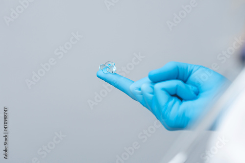 medical gel on doctor's glove, preparation for rectal examination.