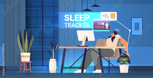 tired woman with electronic smart watch app tracker on hand sleeping at workplace quality and quantity sleep control