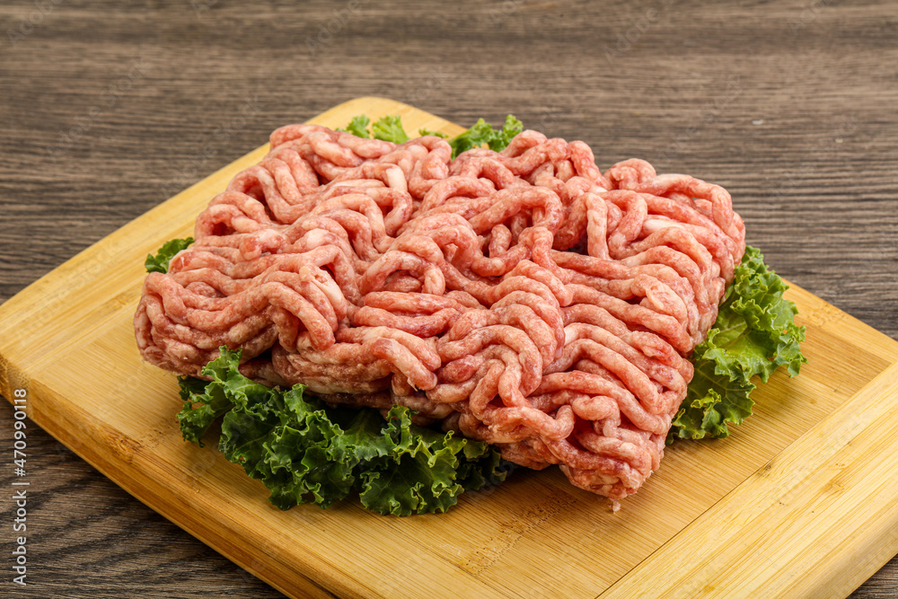 Raw pork minced meat over board Raw pork minced meat over board