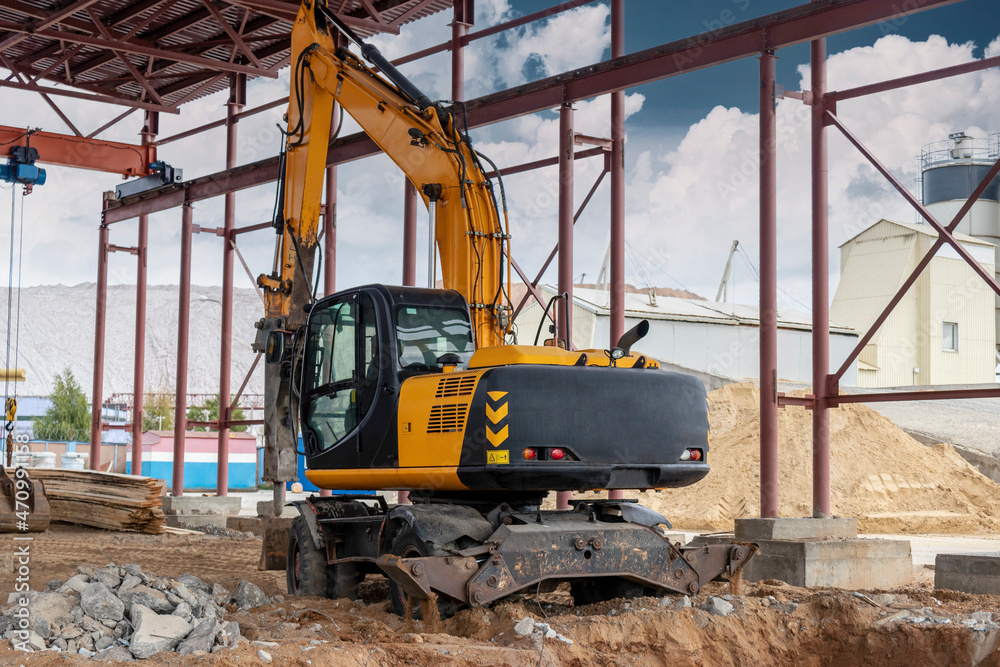 Professional demolition of reinforced concrete structures using industrial hydraulic hammer with excavator. Rods of metal fittings. Wreckage and crumbles of concrete. Professional demolition of reinforced concrete structures using industrial hydraulic hammer with excavator. Rods of metal fittings. Wreckage and crumbles of concrete.