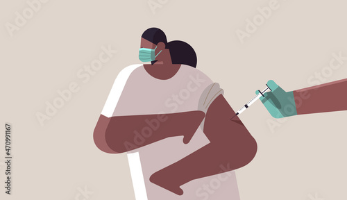 doctor hand vaccinating african american female patient in medical mask fight against coronavirus vaccine development