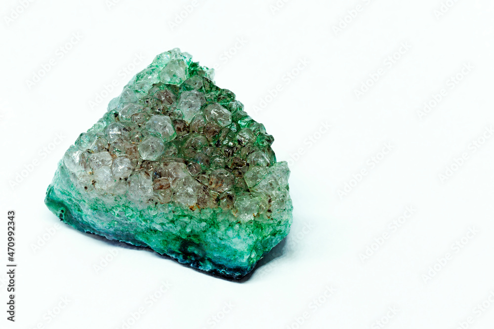 wet green stone with crystals on white background wet green stone with crystals on white background