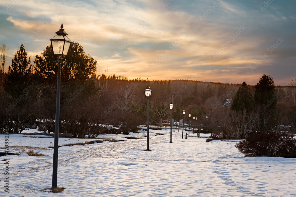 sunset at wintry cemetery