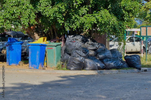 Junk and a pile of black garbage bags