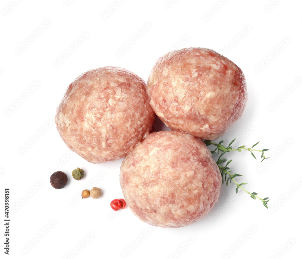 Three fresh raw meatballs with thyme and spices on white background, top view Three fresh raw meatballs with thyme and spices on white background, top view