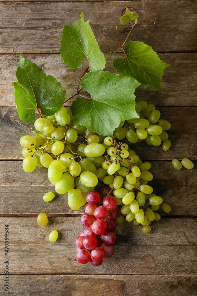 Ripe grapes on wooden background Ripe grapes on wooden background