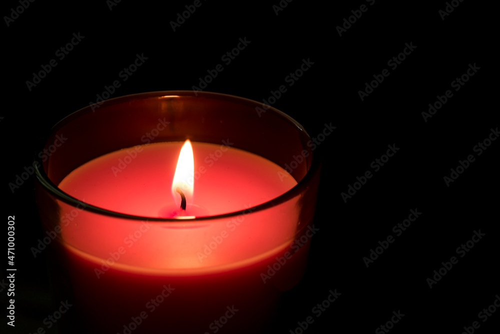Burn lit candles in clear glass for religious night or dark. Burn lit candles in clear glass for religious night or dark.