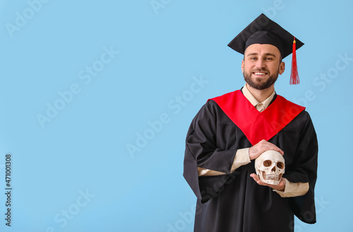 Handsome male graduate with...