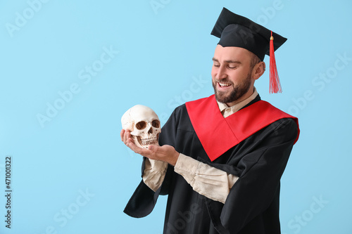 Handsome male graduate with...