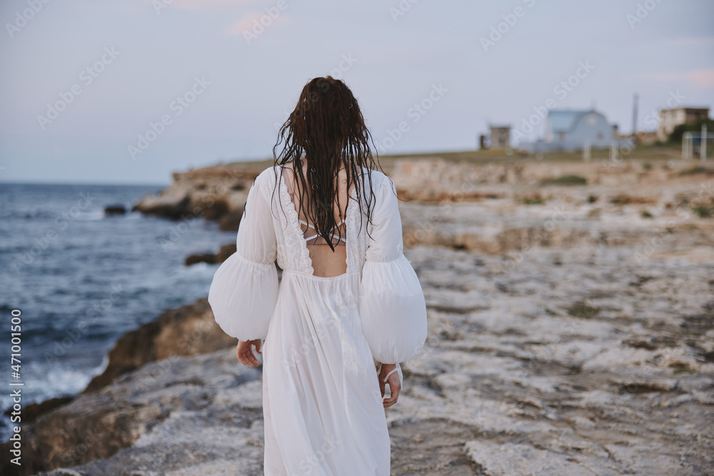 Woman in white dress walk stones nature landscape Woman in white dress walk stones nature landscape