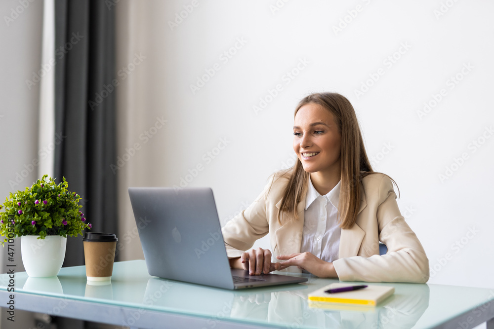 Young business woman with notebook in the office Young business woman with notebook in the office