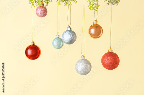 Different Christmas balls on color background