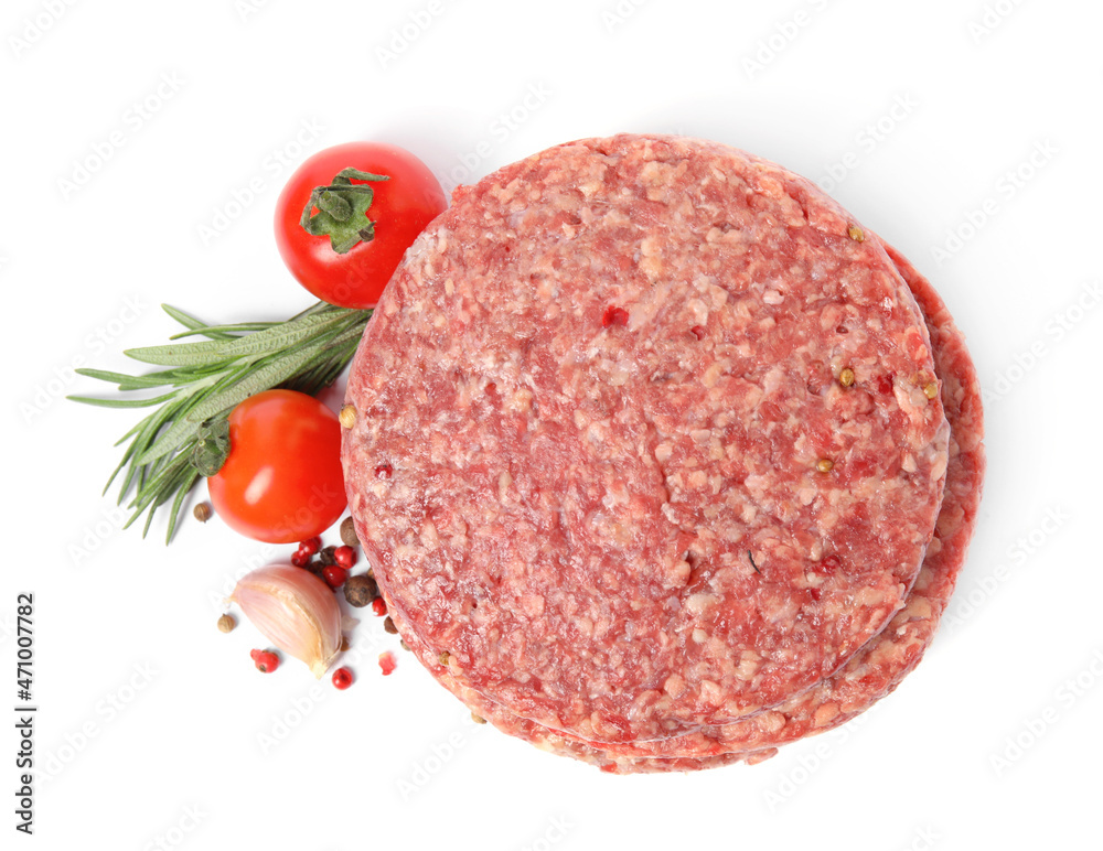 Raw hamburger patties with rosemary, vegetables and pepper on white background, top view Raw hamburger patties with rosemary, vegetables and pepper on white background, top view